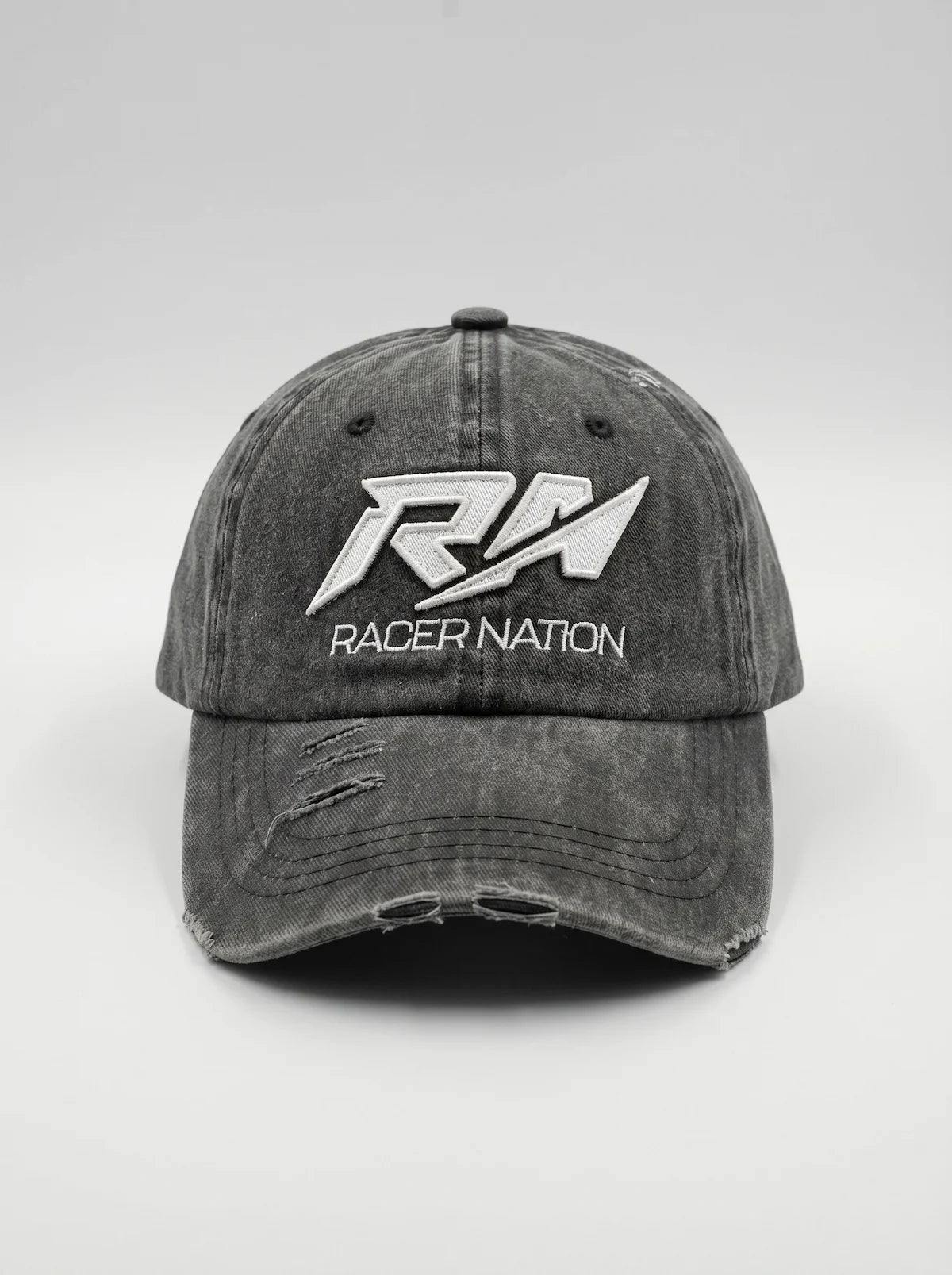 Front view of the Racer Nation distressed grey baseball cap featuring an embroidered white RN logo.
