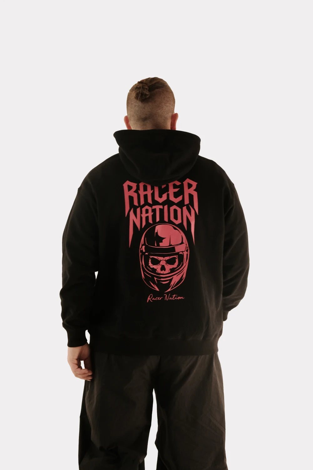 Back view of a model wearing the Racer Nation Ghost Rider black oversized hoodie with a red skull helmet graphic.