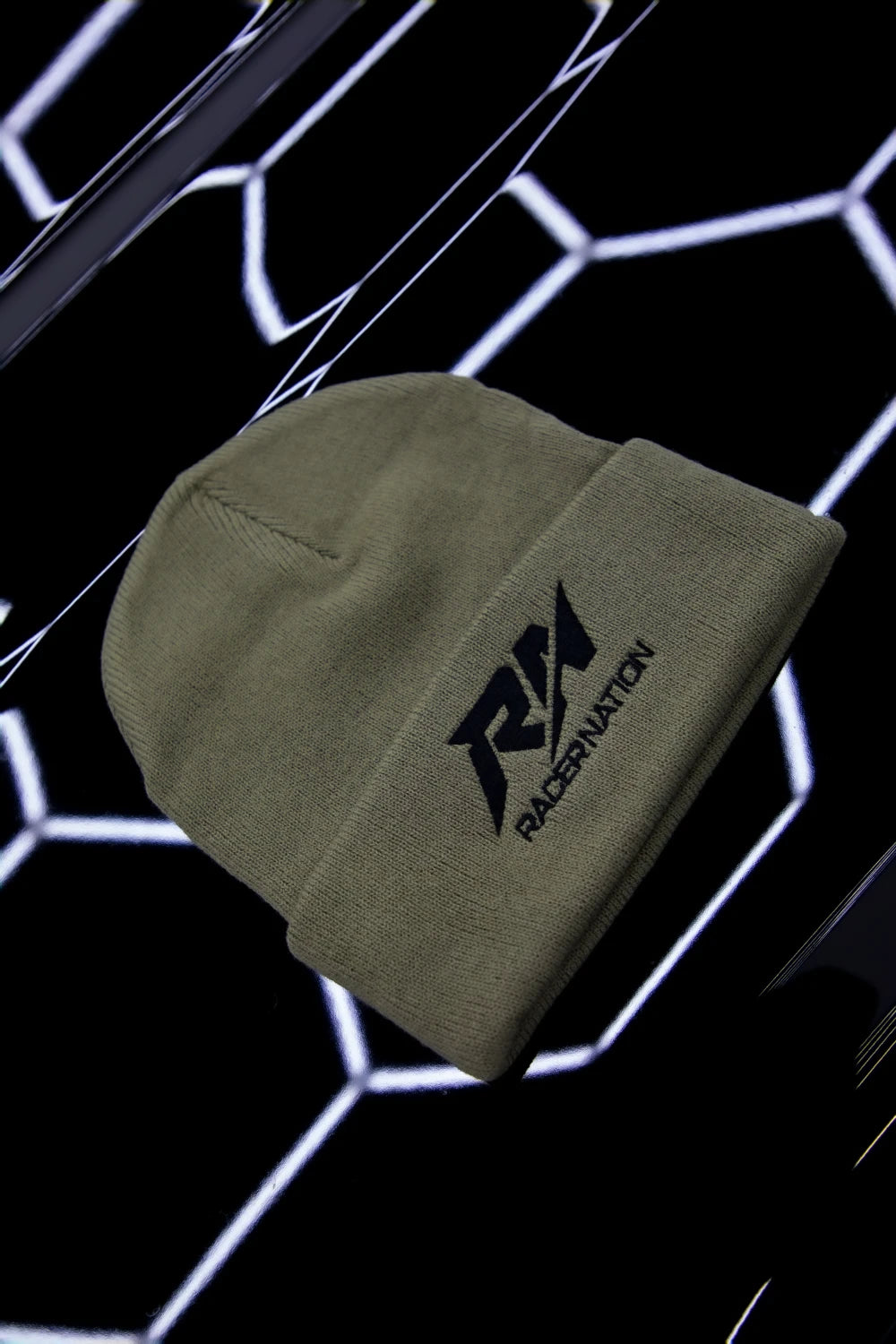 Khaki Racer Nation embroidered beanie featuring the black RN logo on the front.