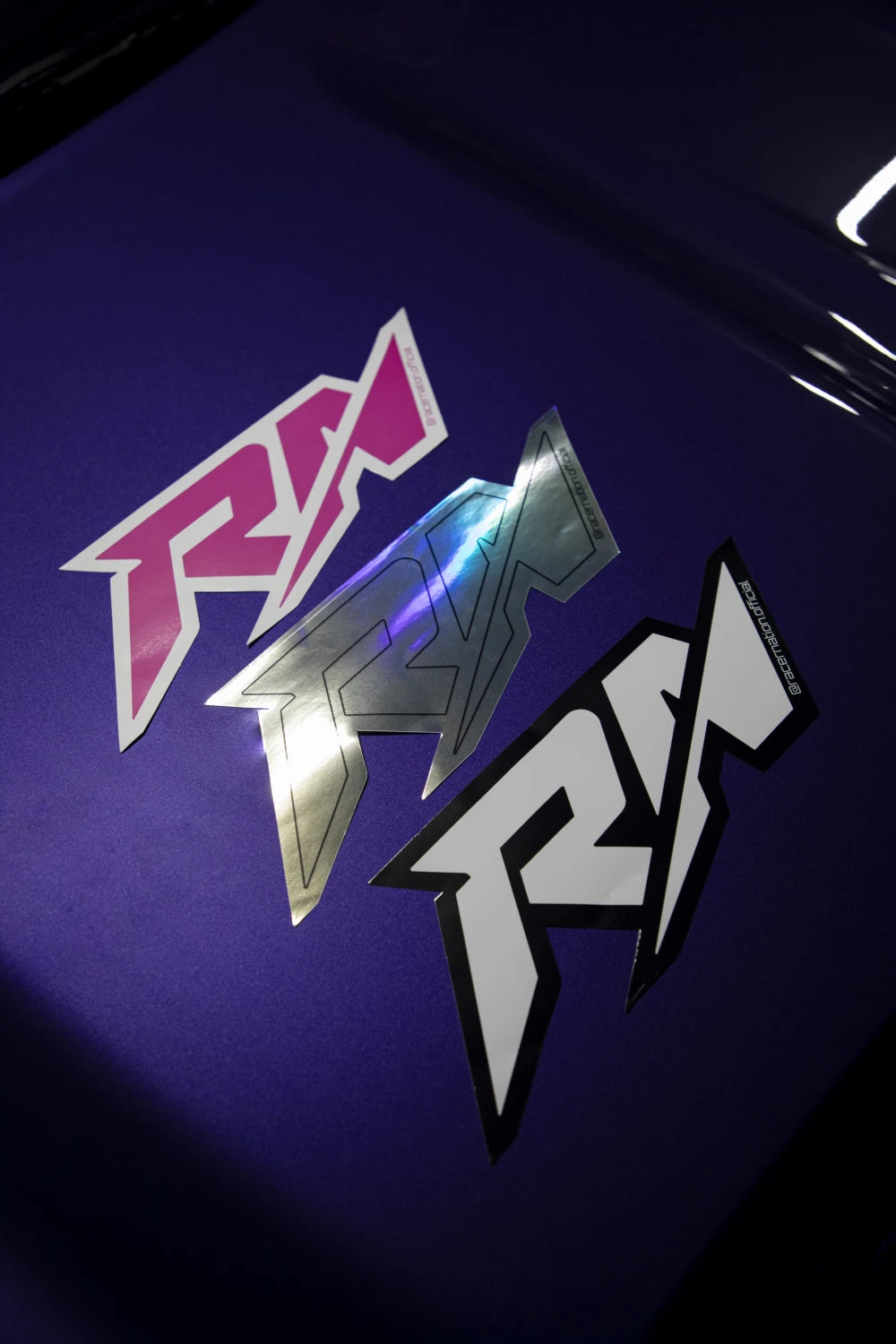 Large Racer Nation RN logo stickers shown in pink and white, holographic, and black and white colour options.