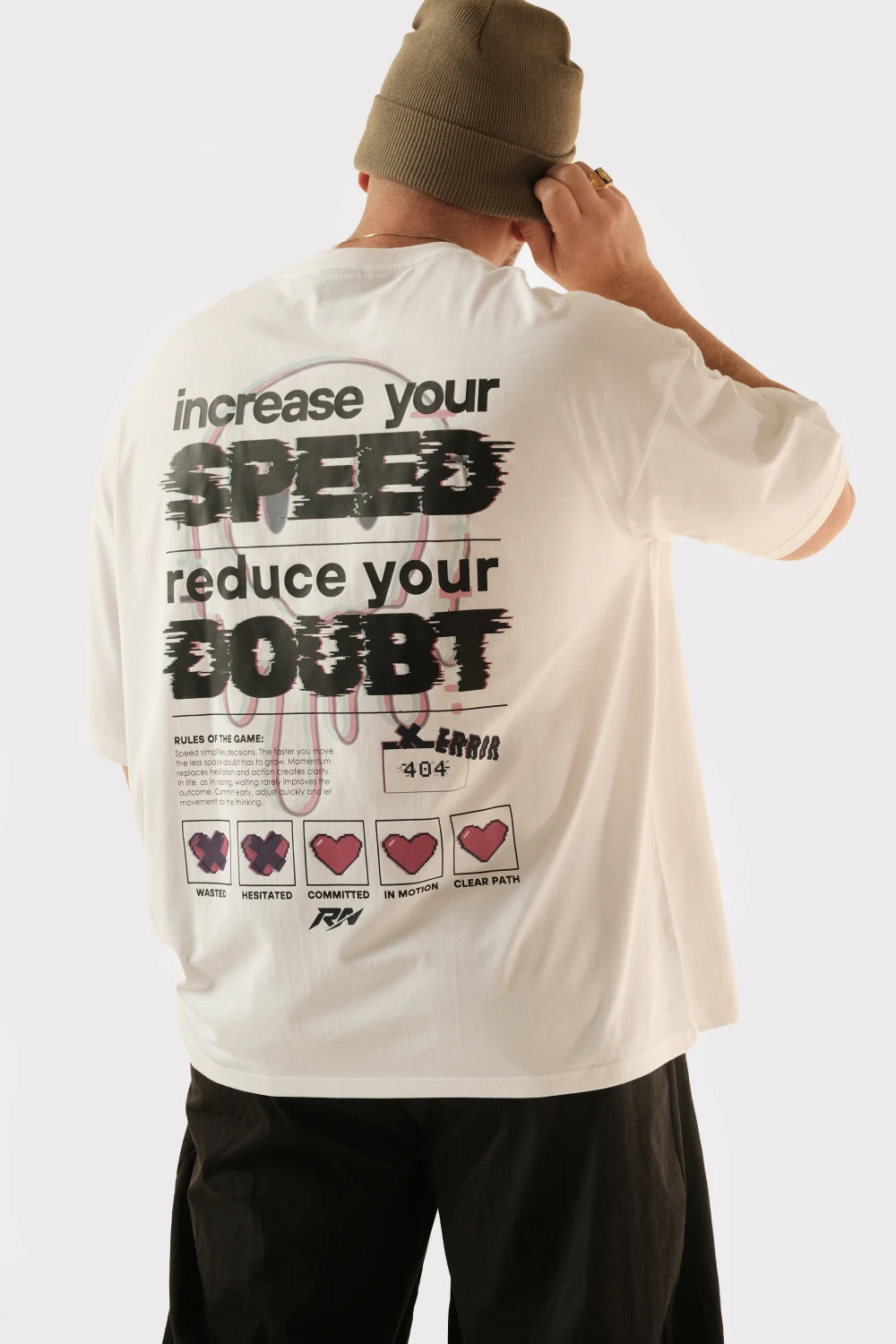 Male model wearing Racer Nation No Doubt white oversized tee showing Increase Your Speed Reduce Your Doubt back graphic