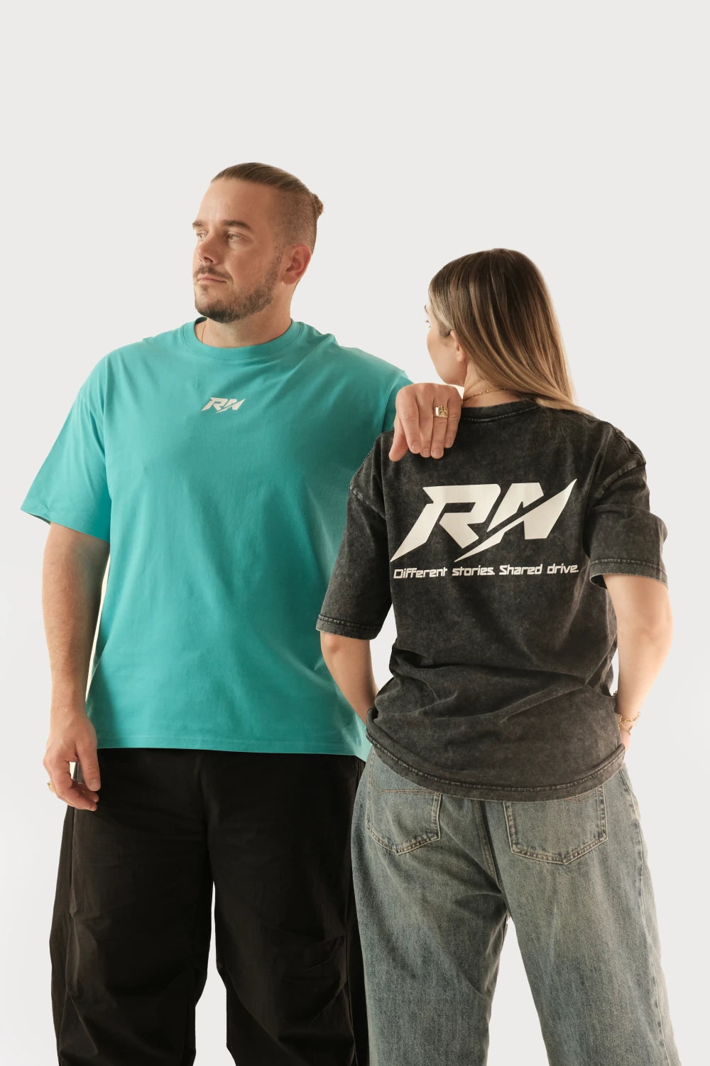 Male and female models wearing Racer Nation RN OG oversized tees in Tiffany Blue and black showing front chest logo and large back logo
