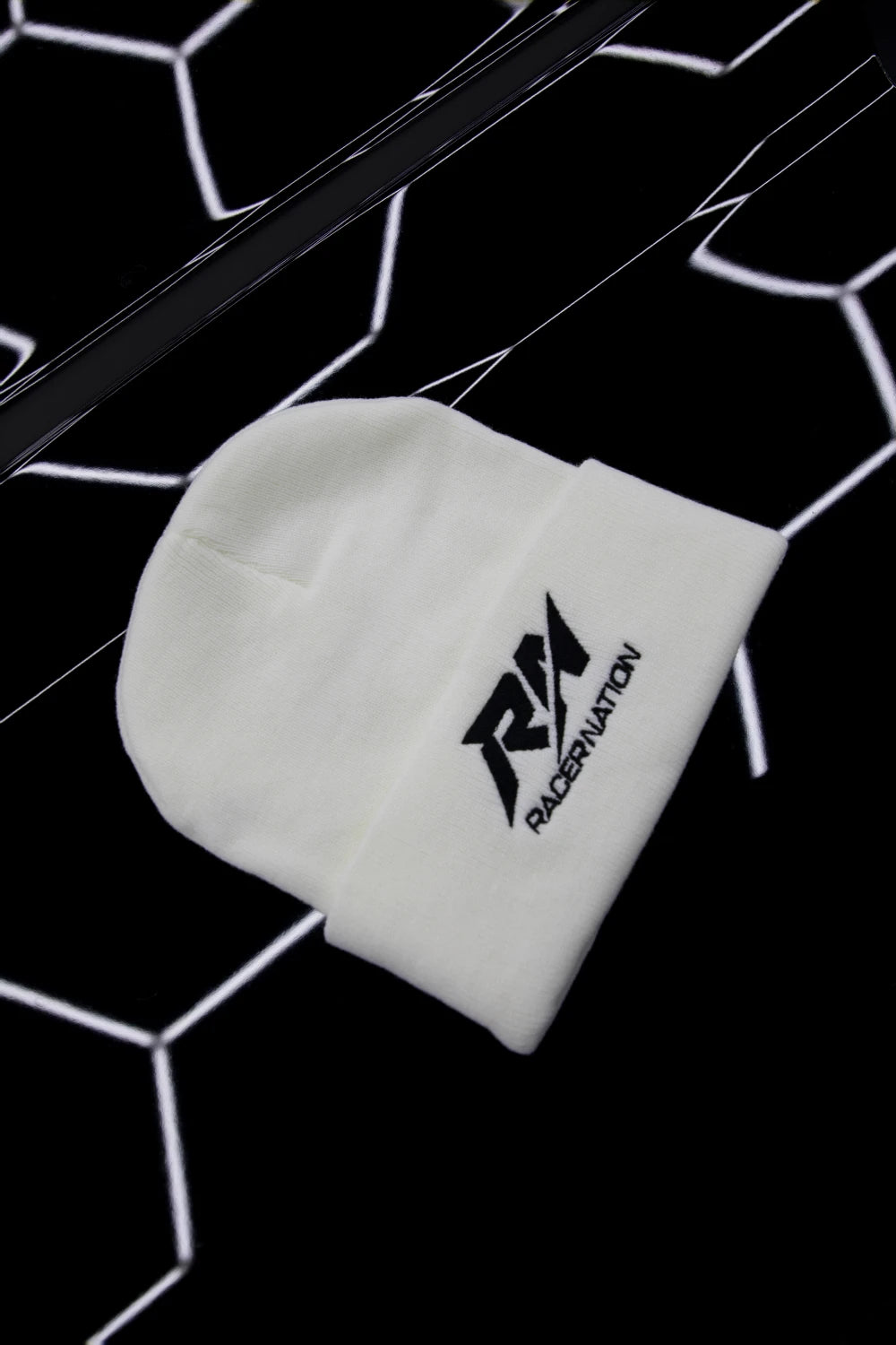 White Racer Nation embroidered beanie featuring the black RN logo on the front.